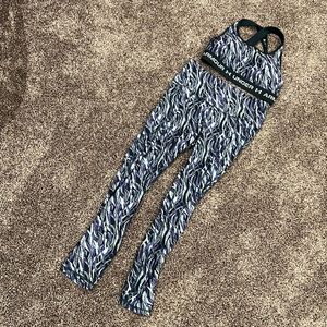 Matching under armor, sports bra and leggings, both in size medium.